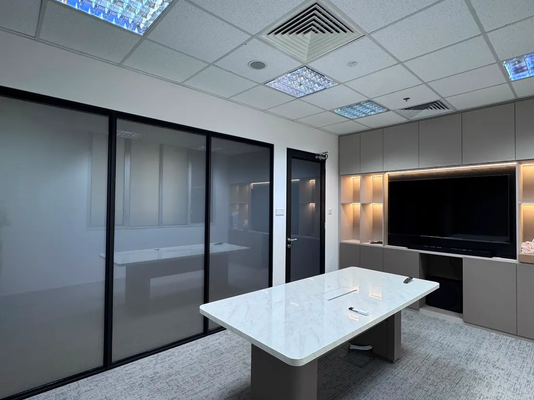 An office meeting room in Singapore with Smart Film applied to the existing glass partition