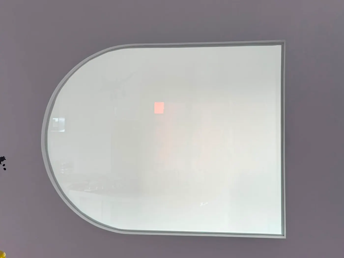 An arched feature panel covered to the curve of the opening, switched to privacy mode