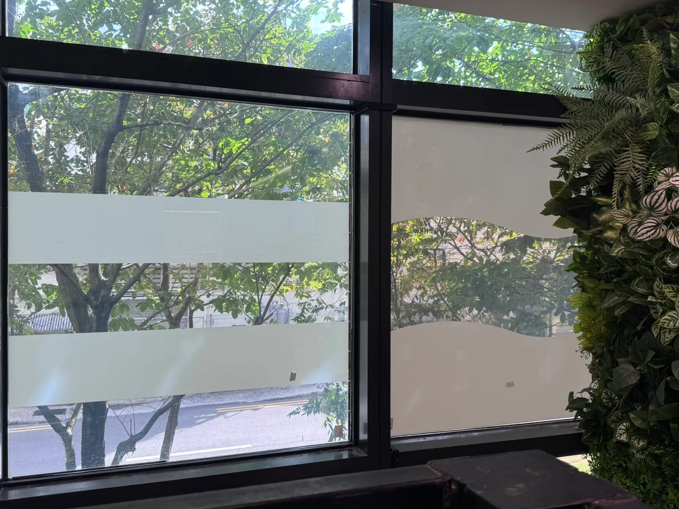 The same fully filmed window switched to privacy mode, the frost forming a wave pattern