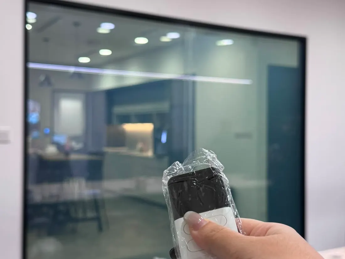 An office meeting room partition with Smart Film switched clear