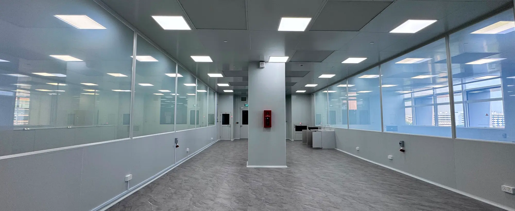 Smart Glass panels along a laboratory corridor at ITE College in Singapore, switched clear