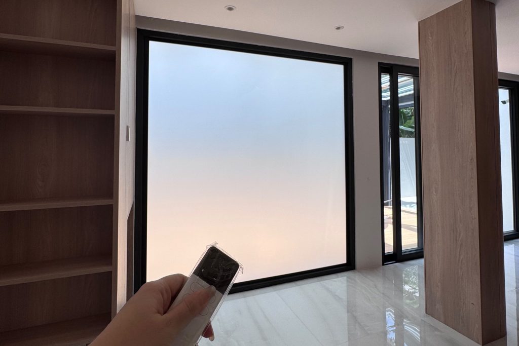 Residential smart film window in frosted privacy mode controlled by remote